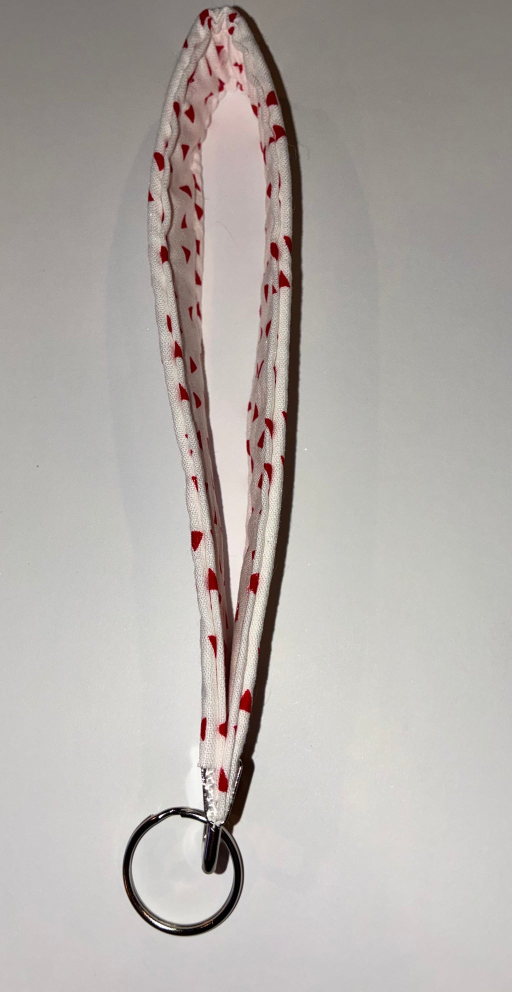 Red and white triangle wristlet keychain ￼