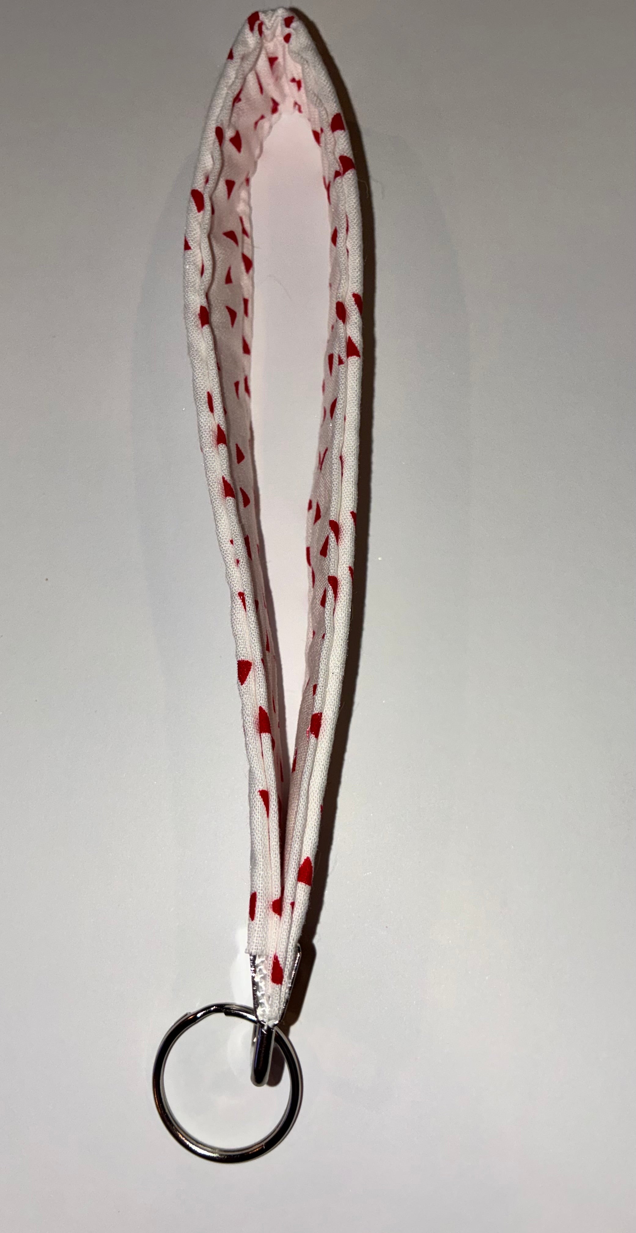 Red and white triangle wristlet keychain ￼